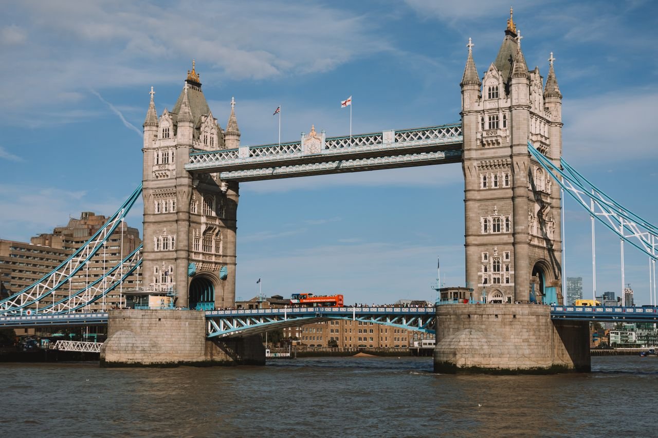 UK Visa Policy Guide: Complete Guide to UK Visas, Immigration and Entry Requirements Stunning daytime shot of the iconic Tower Bridge in London, showcasing blue skies and an urban riverscape.