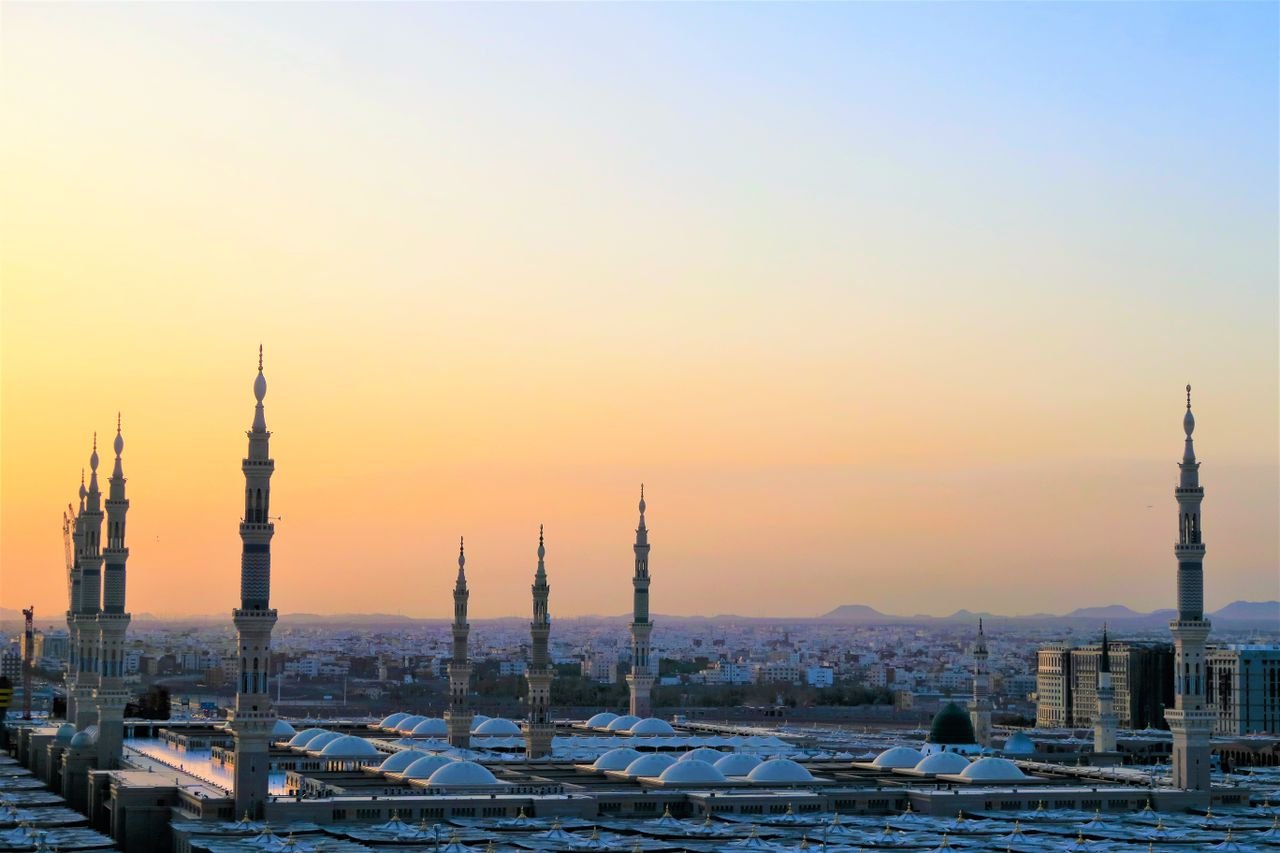 Saudi Arabia Visa Policy Guide: Complete Guide to Saudi Visas, Immigration and Entry Requirements Stunning view of the Prophet's Mosque minarets at sunset in Medina, Saudi Arabia.